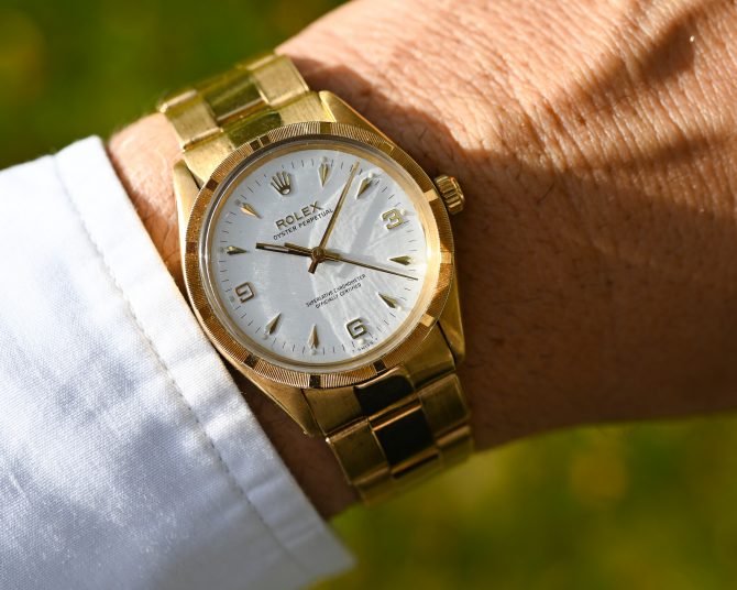 Rolex Oyster Perpetual 6567 in Gelbgold mit 7205 Goldband und Big Logo Schließe
